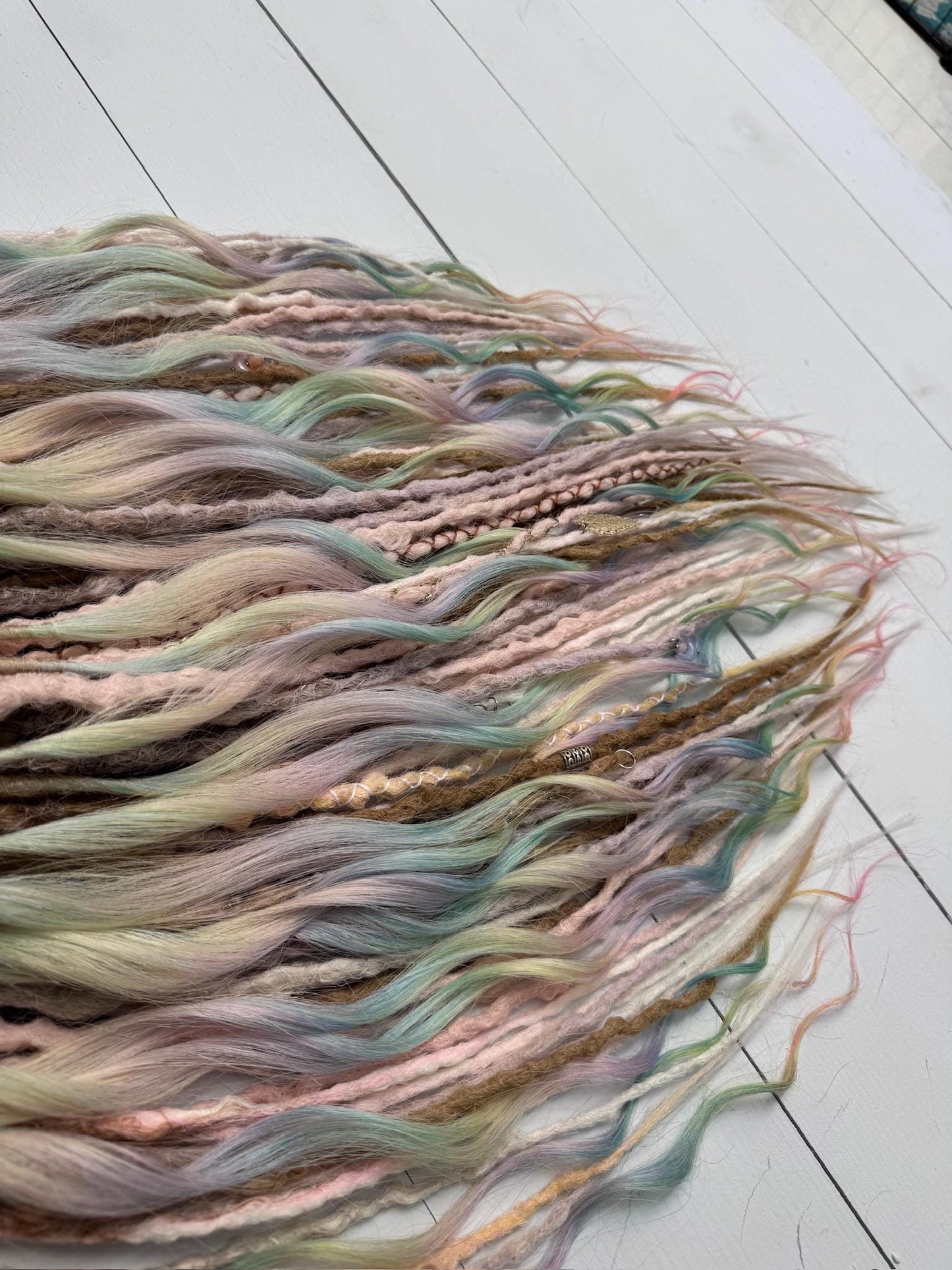 Pastel Rainbow Dreadlock Extensions with Braids, Curls, and Hair Charms